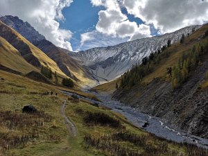 Autumn landscape in Zernez at the Swiss National Park, Switzerland, showcasing colourful foliage and mountainous scenery.