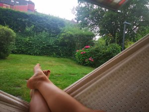 Person resting on a hammock, emphasizing the importance of taking a break and self-care.